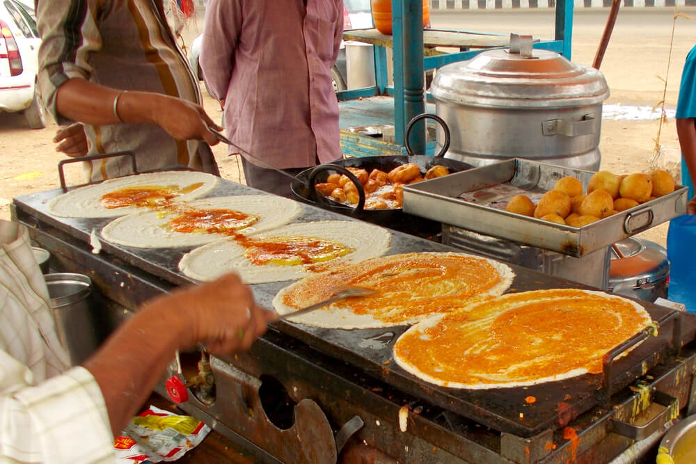 Indian street food vendor with fresh ingredients