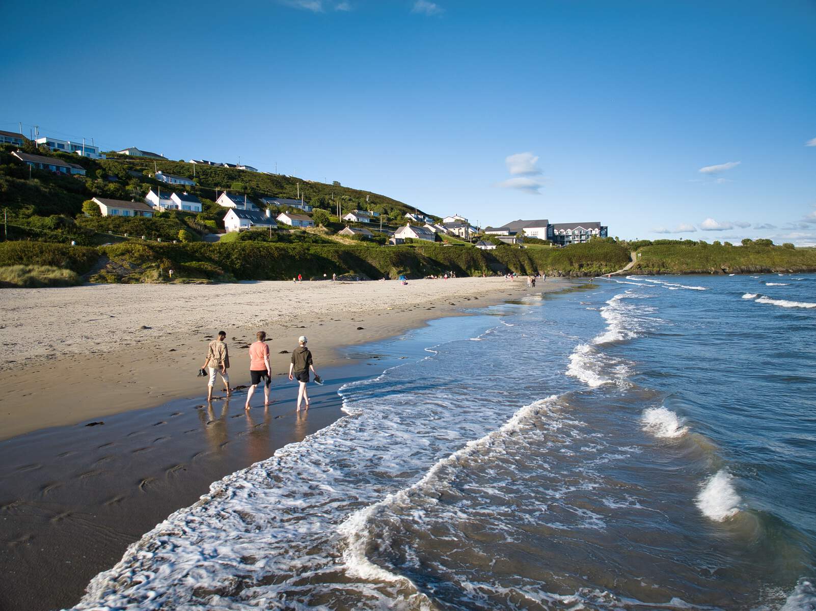 Feet in the sand on Irish beach feeling golden sand between toes